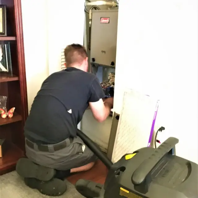 M&H technician with professional cleaning equipment