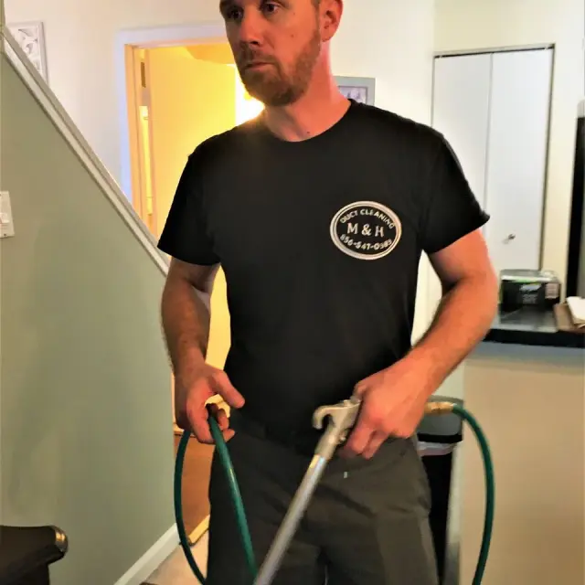 Certified technician inspecting HVAC system