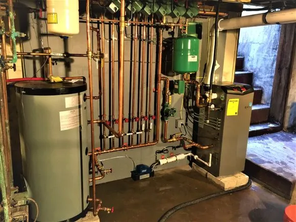 Boiler room with copper piping and HVAC equipment
